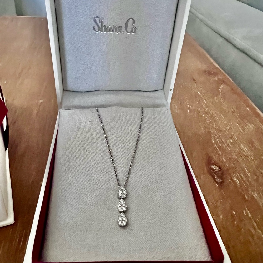 Elegant Pendant in 14K White Gold with three round diamonds at .31 CT Total Gem